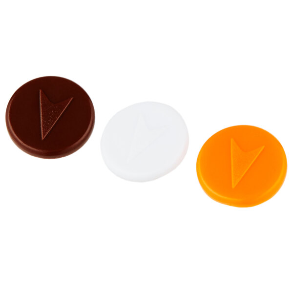 A close-up of a white Vollrath SwirlServe beverage server with three orange, black, and white plastic buttons.