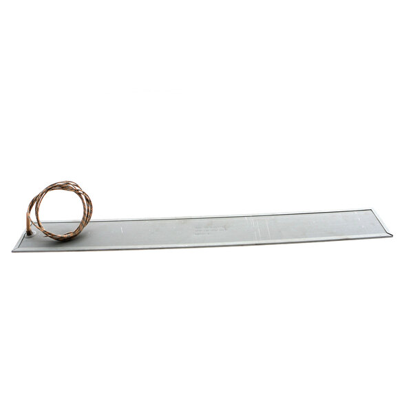 A metal plate with a coil of wire on it.