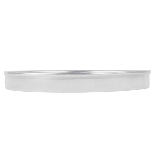 An American Metalcraft aluminum pizza pan with a silver rim.