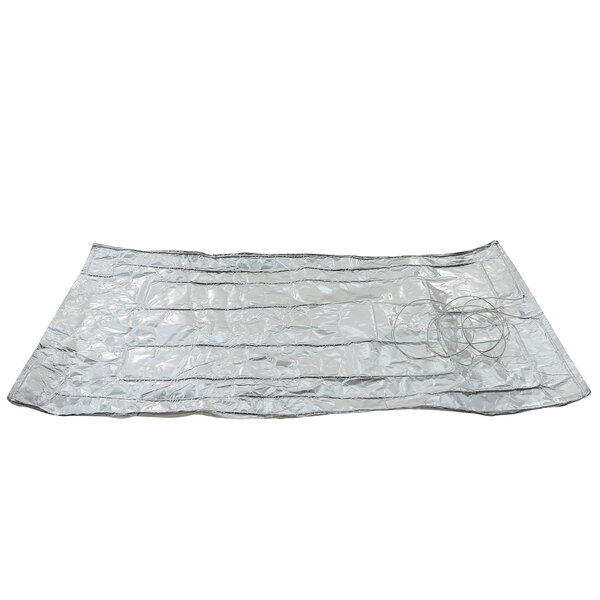A silver blanket with wires on it.