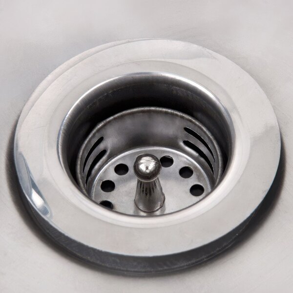 A stainless steel Advance Tabco hand sink drain.