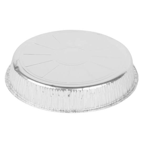 A round silver aluminum foil cake pan with a lid.