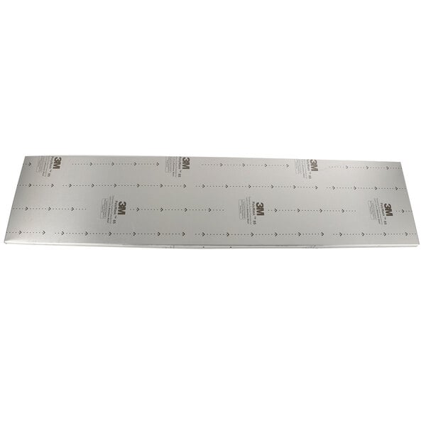 A white rectangular metal lid with holes in it.