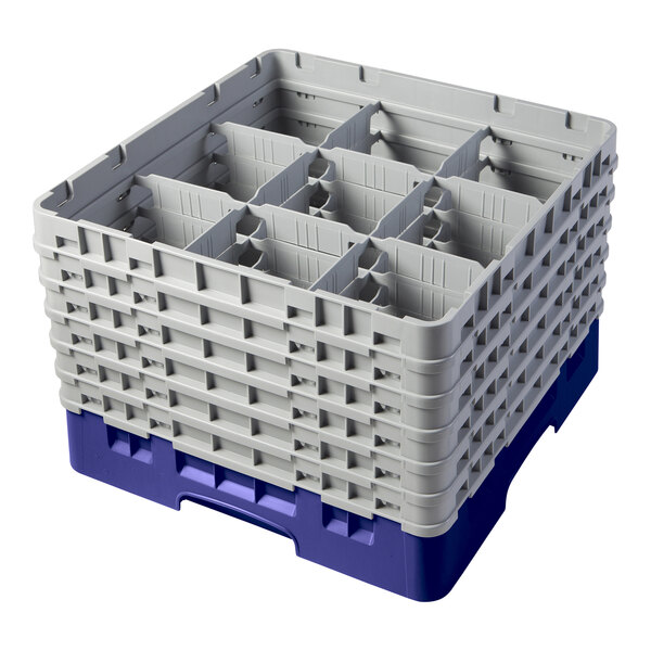 A navy blue plastic Cambro glass rack with nine compartments and six extenders.