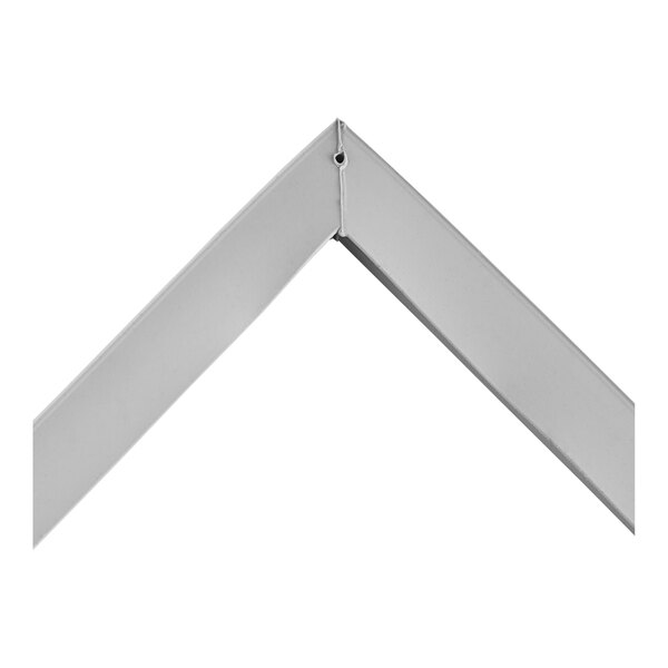 A grey metal gasket with white corners.