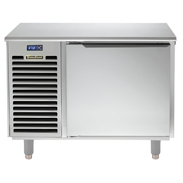 A silver Traulsen undercounter refrigerator with a door.