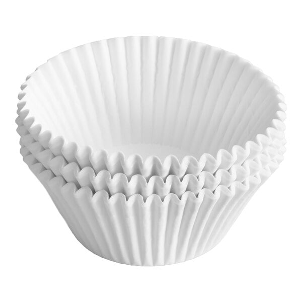 A stack of white, fluted paper baking cups.