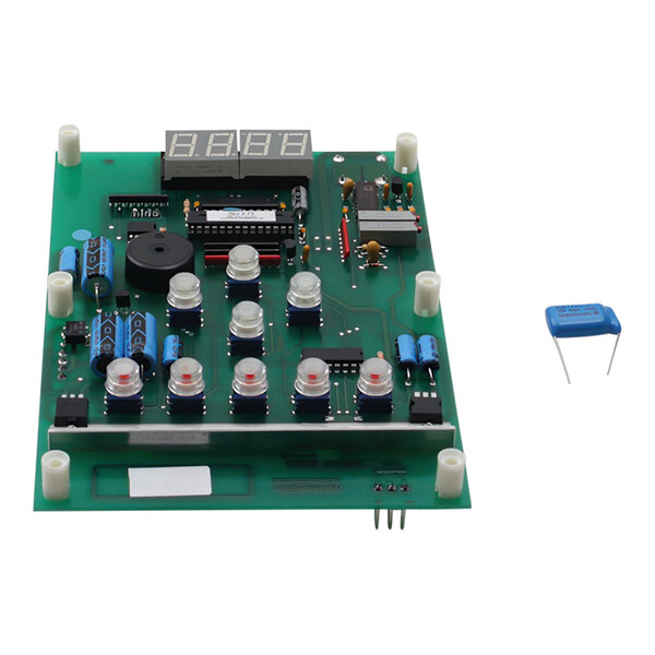 A green Duke 600108 control board with a blue capacitor.