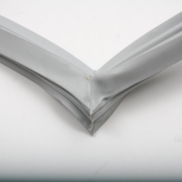 A close up of a grey rubber corner piece.