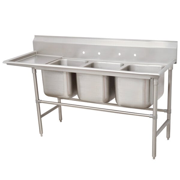 A stainless steel Advance Tabco three compartment sink with a left drainboard.