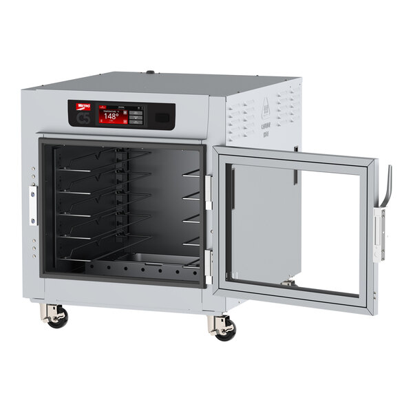 A Metro C5 holding cabinet with a clear door open.