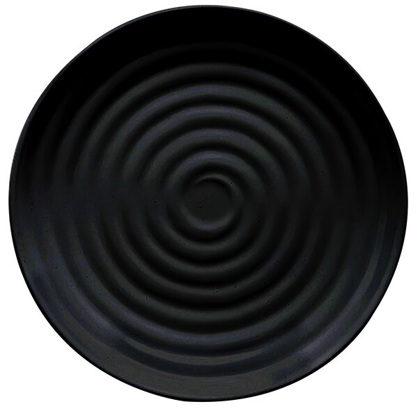 A black melamine plate with a spiral pattern in the center.