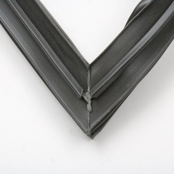 A close-up of a black rubber seal on a black frame.