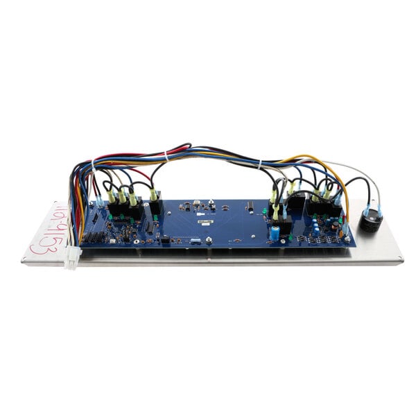 A blue NU-VU programmable control circuit board with many wires.