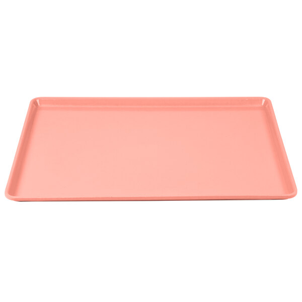 A pink rectangular Cambro dietary tray with a white border.