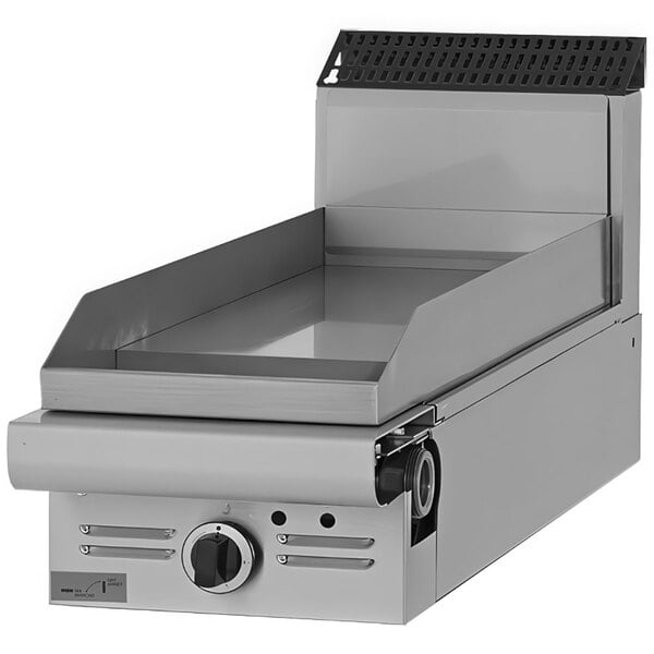 A Garland Master Series natural gas modular griddle with thermostatic controls on a counter in a professional kitchen.