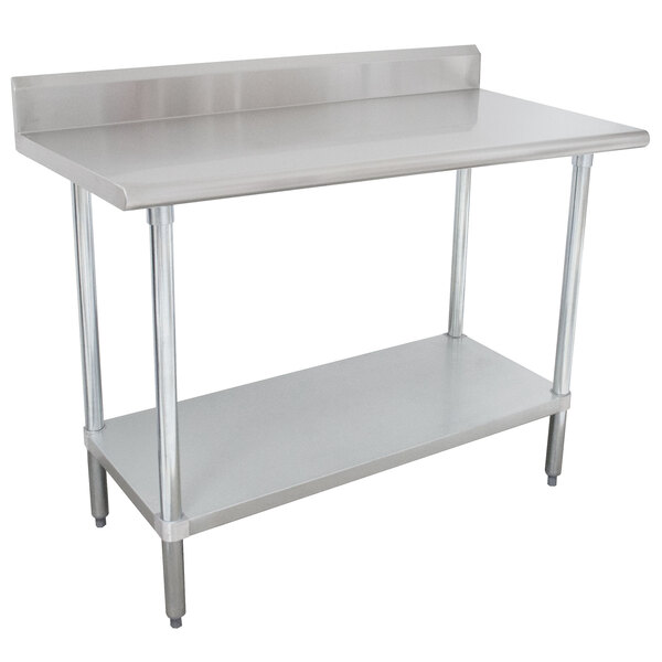 A stainless steel Advance Tabco work table with undershelf.