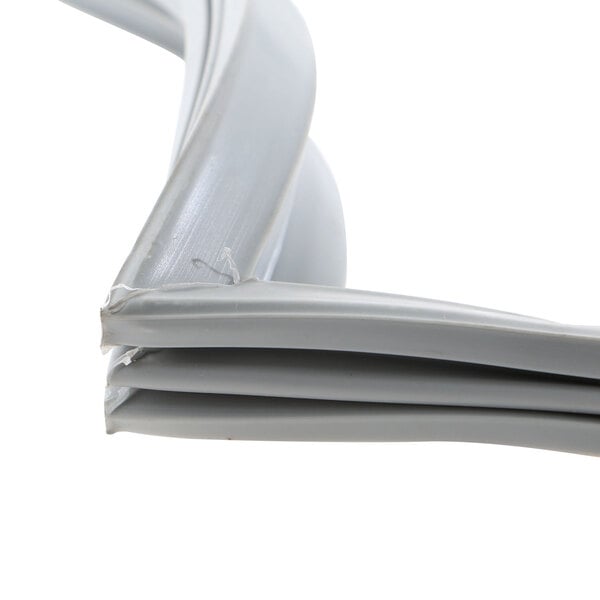 A close up of a white plastic strip with a grey plastic window frame.