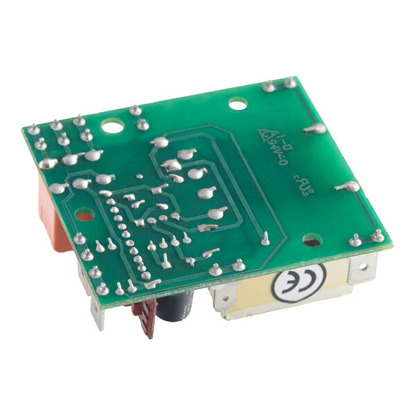 A green printed circuit board with visible solder points, electronic components, and a CE marking on the side.
