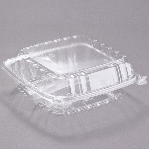 A Dart clear plastic container with a square top and 3 compartments.