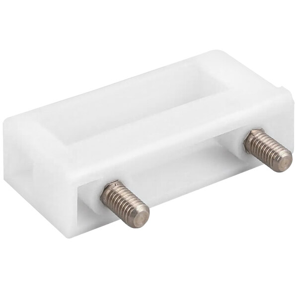 A white plastic Jet Tech door catch box with two screws.