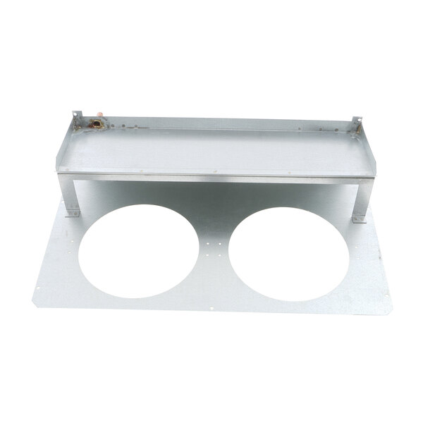 A metal drain pan with two white circles.