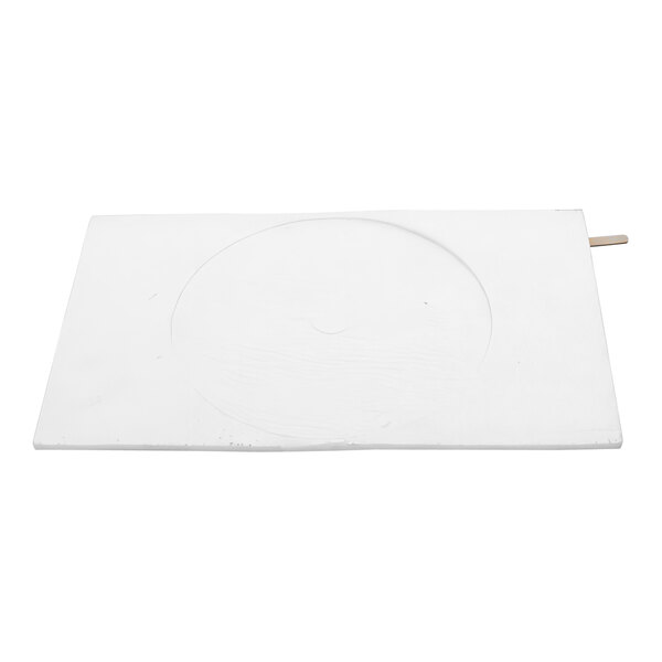 A rectangular white board with a circular design in the middle.