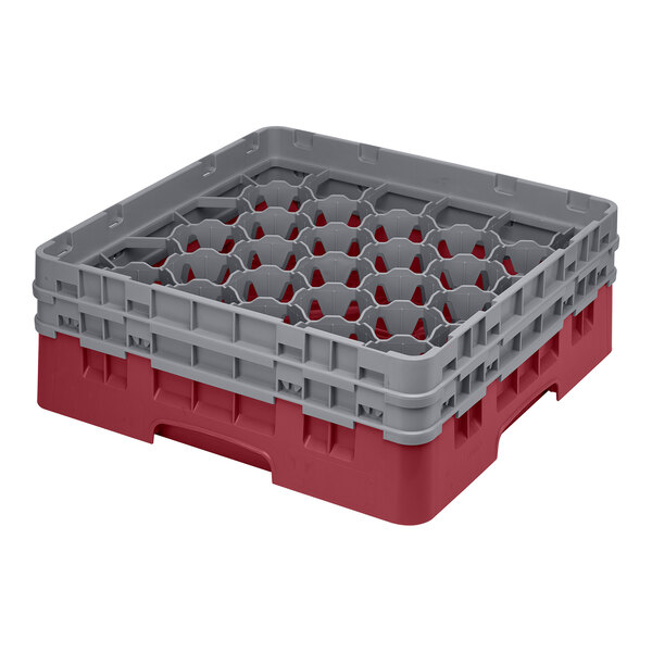 A cranberry and gray glass rack with 30 compartments for washing and storing glassware.