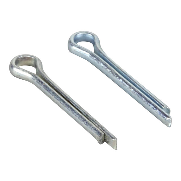 A close-up of a pair of metal cotter pins with metal loops on the ends.