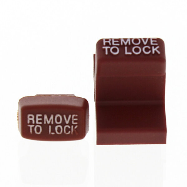 A close-up of two brown keys with white text.