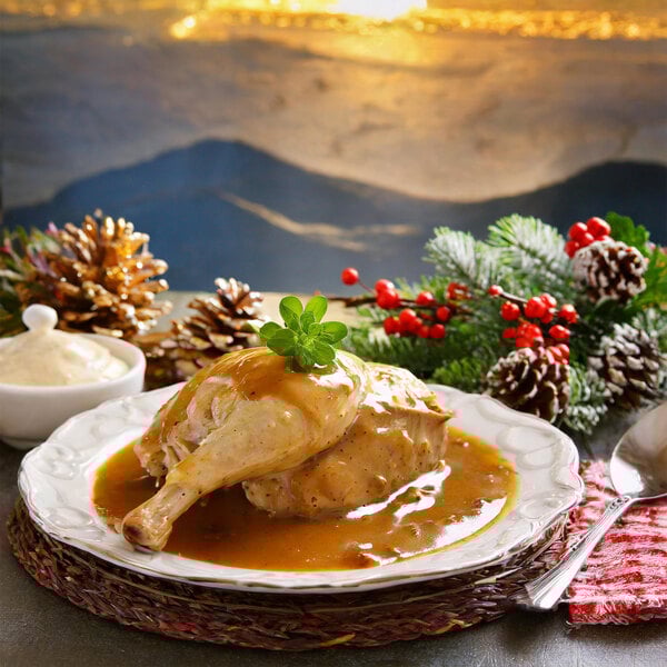A plate of food with chicken and Chef's Companion Chicken Gravy on top.