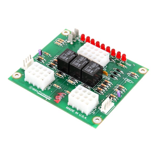 A Frymaster PCB with a green circuit board and white and red objects.