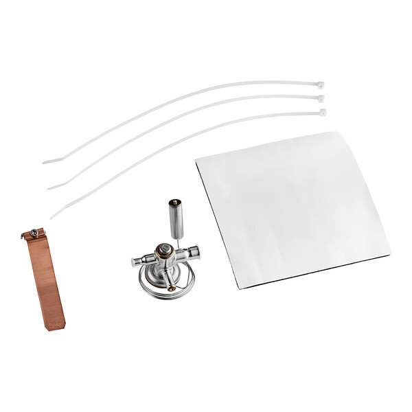 A white and brown metal Ice-O-Matic expansion valve with hooks.