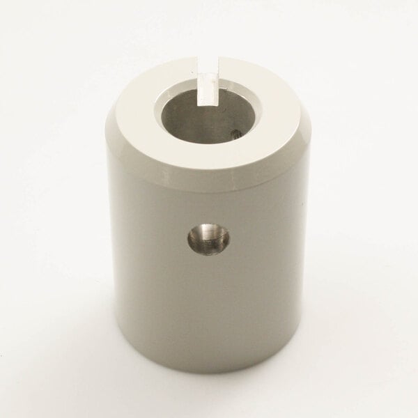 A white metal cylinder with a hole, the Blakeslee 98377 Hub Attachment.