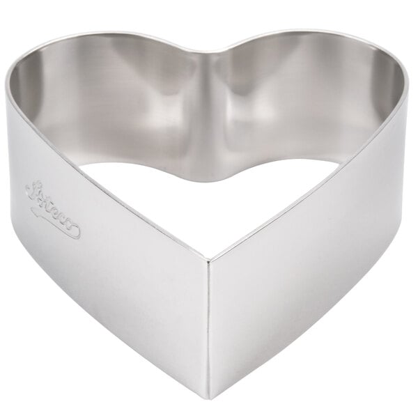 A silver Ateco heart shaped mold.