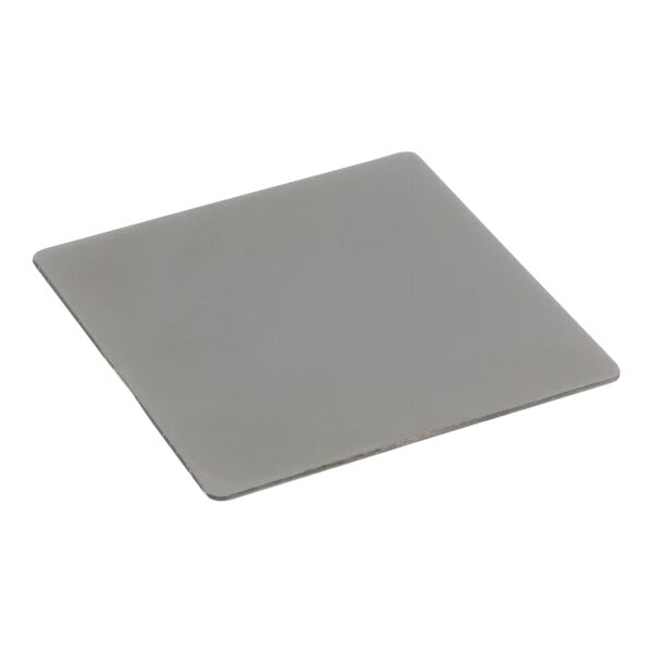 A painted gray square Frymaster drain cover.