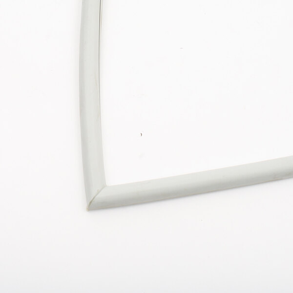 A white gasket with a small hole in it.