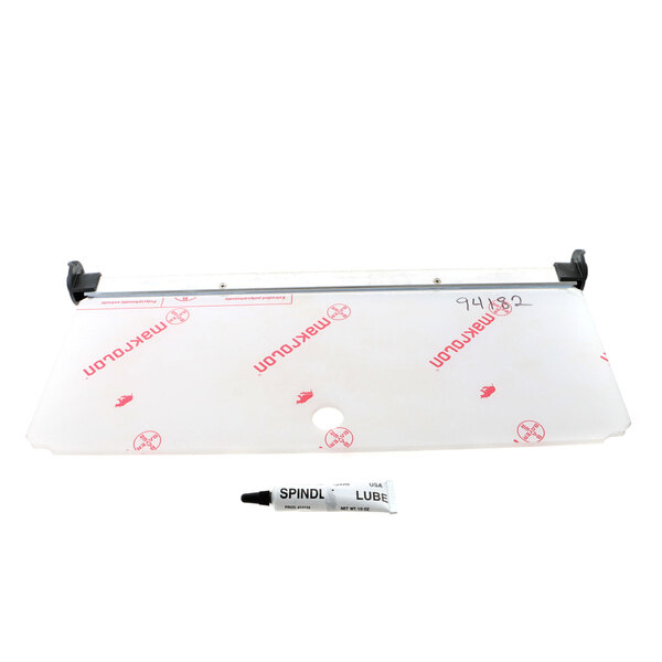 A white plastic rectangular sheet with red text.
