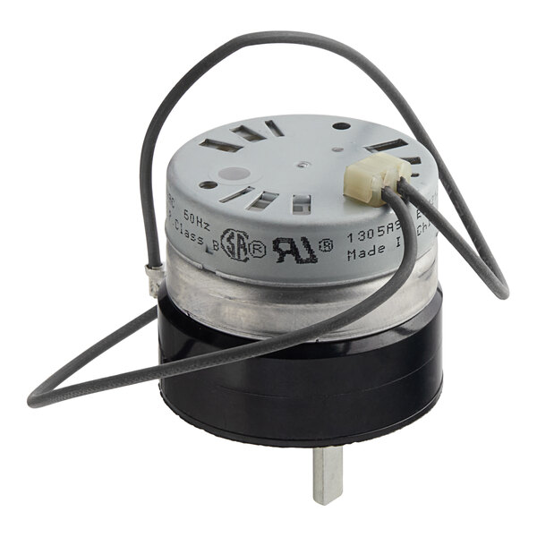 A small round metal and black Hobart Timer with wires attached.