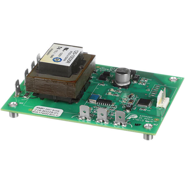 A green circuit board with a square electronic component.