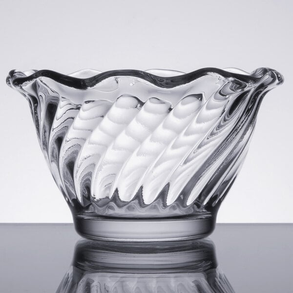 A clear Anchor Hocking Waverly sherbet glass with a wavy design.