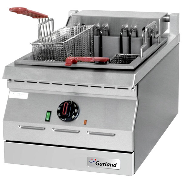 A Garland electric countertop deep fryer with two baskets on a counter.