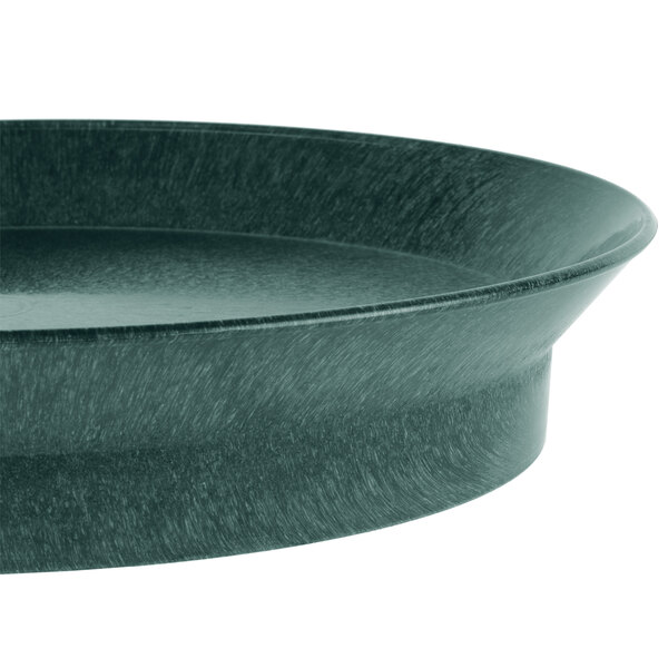 A black oval deli server with a green rim.