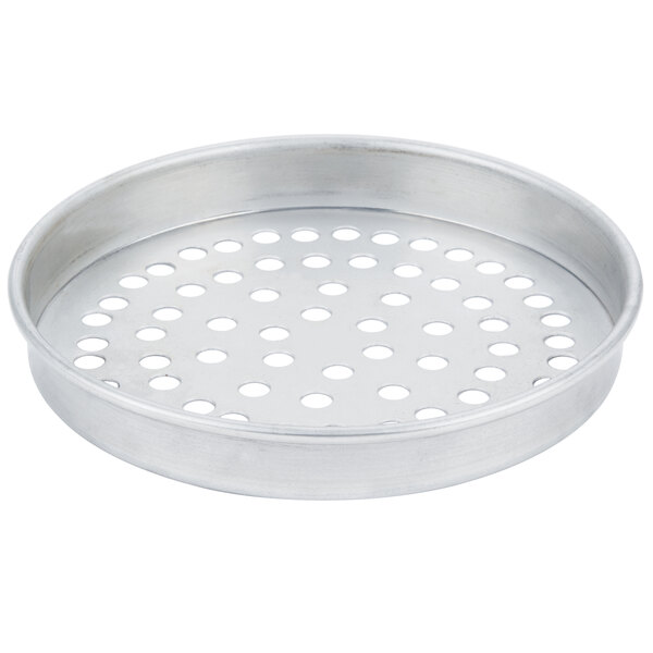 A silver pan with holes in it.