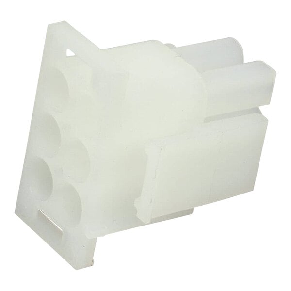 A close-up of a white plastic Frymaster connector with holes.