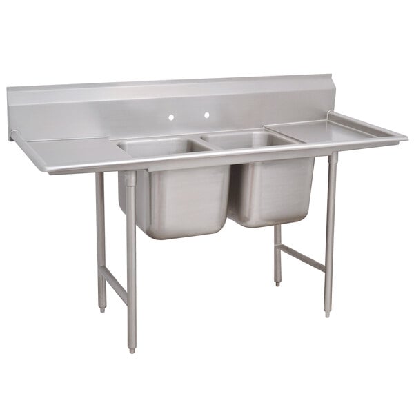 A stainless steel Advance Tabco two-compartment pot sink with two drainboards.