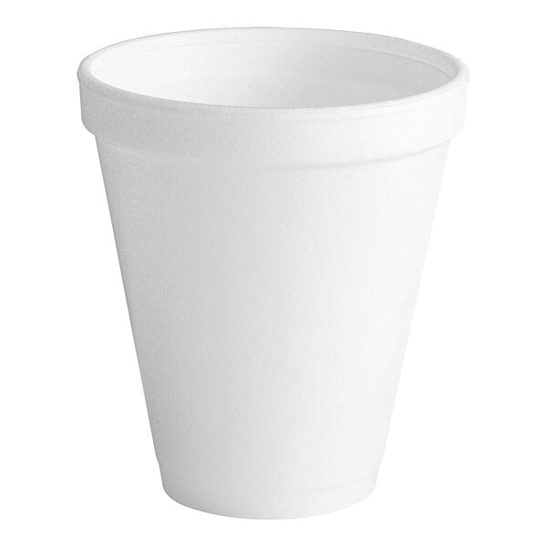 A close-up of a Dart white styrofoam cup.