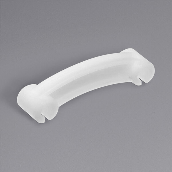 a white plastic object on a gray background