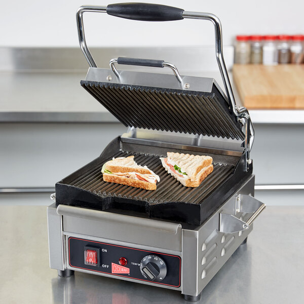 A sandwich being grilled on a Cecilware Panini Sandwich Grill.