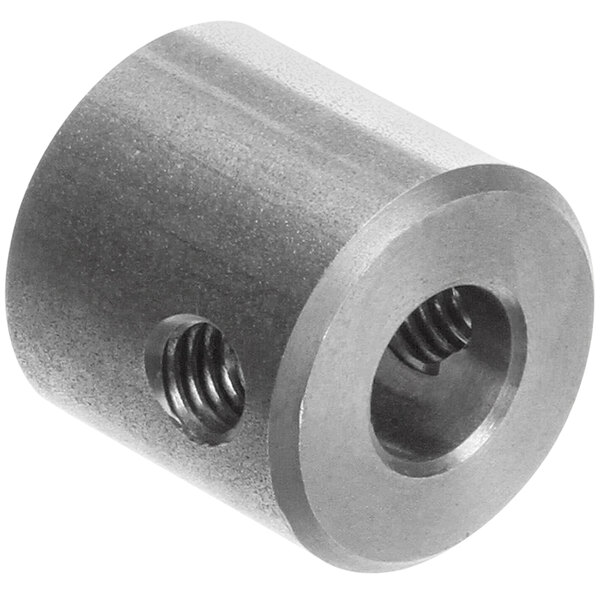 A close-up of a metal cylinder with a hole and a screw.